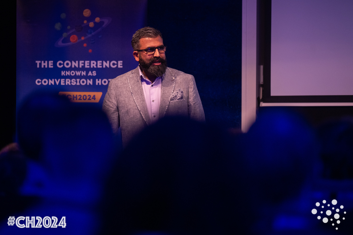 Amrdeep Athwal speaking to the audience at Conversion Hotel 2024